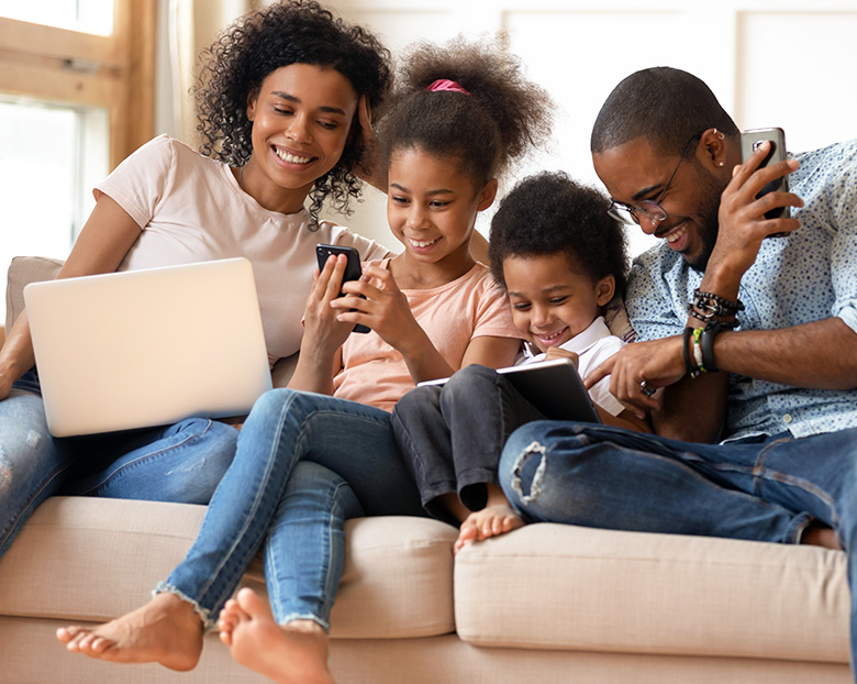 Family with Laptop, Tablet, and Cell Phones